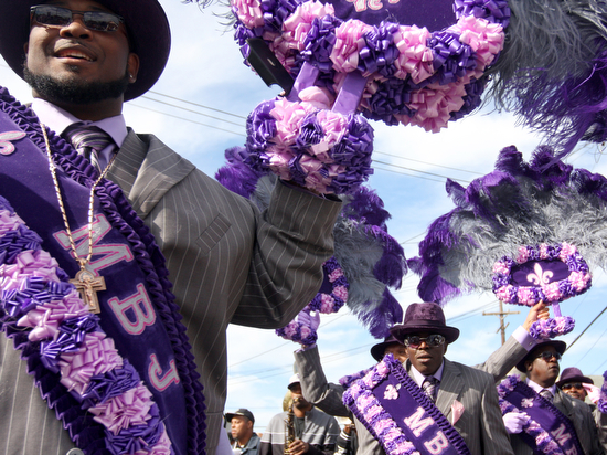 The Original New Orleans Ladies, Men and Junior Buckjumpers annual second line leaves E&C Lounge and travels down Apple St. Sunday afternoon. The second line rolled through Gert Town, into Milan and finished in Central City. (Sabree Hill, UptownMessenger.com)