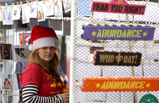 A shopper at the Frereststivus market in December 2010. (UptownMessenger.com file photo by Sabree Hill)