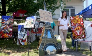 The artwork of Isabelle Jacopin (left) and Simon Hardeveld (right) at Fete Francaise Saturday afternoon. (Sabree Hill, UptownMessenger.com)