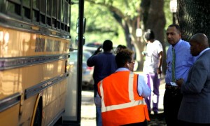 RSD Superintendent Patrick Dobard stands outside a school bus on Napoleon Avenue in 2012. (UptownMessenger.com file photo)