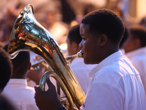 A member of the St. Augustine Marching 100 plays in the Battle of the Bands for the Instruments A-Comin' benefit at Tipitina's in April 2012. (UptownMessenger.com file photo by Robert Morris)