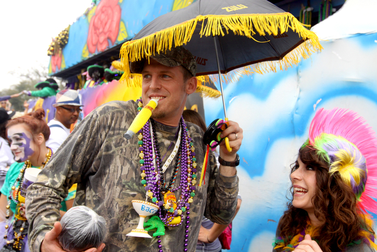 Fake cigars are a traditional throw during the Krewe of Zulu parade. (UptownMessenger.com file photo by Sabree Hill, Feb. 13, 2013)