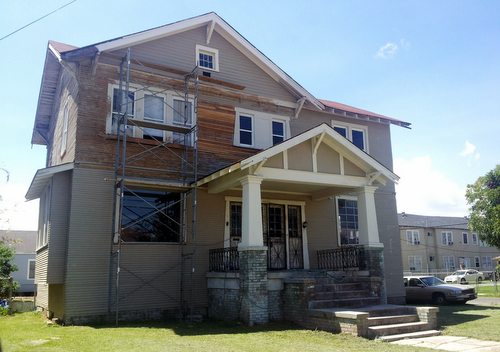 D'Artanian Stovall's house on Upperline Street, where he is stripping and repainting one section at a time to avoid the ire of city inspectors. (Robert Morris, UptownMessenger.com)