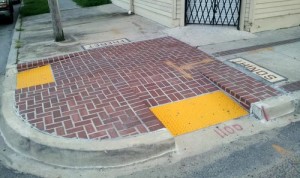 The brick "bumpout" corners installed last year on Freret Street will be replaced starting Nov. 4, officials said. (UptownMessenger.com file photo by Robert Morris)