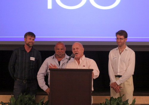 John Hill, center, a former director of the Forum for Equality whose house was the target of anti-gay vandalism, introduces other victims of hate crimes at a forum at the Jewish Community Center on Tuesday. (Robert Morris, UptownMessenger.com)
