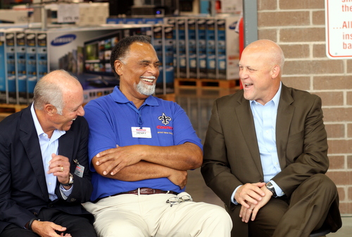 Costco cofounder Jeff Brotman (left), Costco New Orleans employee Henry Lagarde and Mayor Mitch Landrieu laugh together during the Costco grand opening ceremonies. (Robert Morris, UptownMessenger.com)