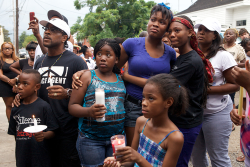 Sierra Gayles , sister of Arabian Gayles, and friend Armani Hooks, hold each other during the vigil. (Sabree Hill, UptownMessenger.com)