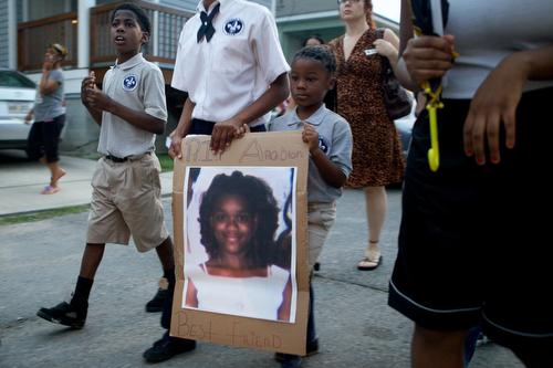 Friends, family and community leaders march during the vigil. (Sabree Hill, UptownMessenger.com)
