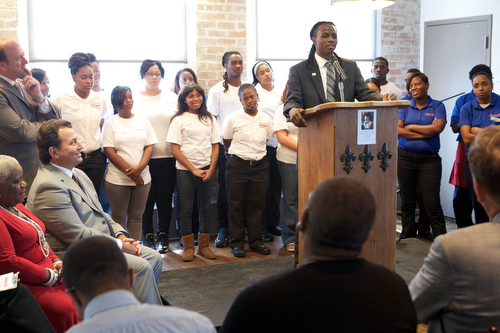 Ryan Dalton, a 2009 graduate of the Cafe Reconcile job training program, speaks at the building dedication and blessing. Dalton was shot three times his first week in the Cafe Reconcile job training program. Today he serves on the Mayor's team as the NOLA FOR LIFE Midnight Basketball coordinator for the City of New Orleans. "Invest in a young person and see what their potential is," said Dalton. (Sabree Hill, UptownMessenger.com)