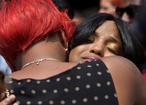 Andrea Samuels, mother of Londyn Samuels, cries as she is comforted by family and friends at her daughter's funeral. (Sabree Hill, UptownMessenger.com)