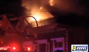 A house burns in a fire in the 2000 block of First Street. (photo via WWL-TV)