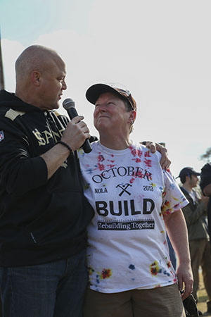 New Orleans mayor Mitch Landrieu, left, introduces Ann Drorbaugh, right, in his opening remarks. Drorbaugh has visited New Orleans 21 times since Hurricane Katrina to help in the rebuilding effort. (photo by Zach Brien for UptownMessenger.com)