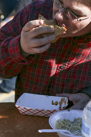 Ida Hancock enjoys a rockstar oyster poboy from Food from Seither's at the first annual Freret Street Oyster Jam. 