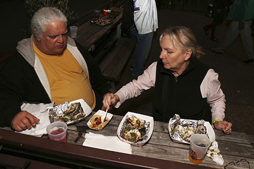 Ernest and Marlene Santalla celebrate their wedding anniversary with some oysters rockefeller at the Freret Street Oyster Jam. (Zach Brien, UptownMessenger.com)