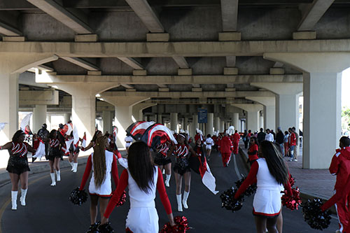 Martin Luther King Jr. Charter School cheerleaders parade under the overpass during the 27th annual MLK Jr. parade. (Zach Brien, uptownmessenger.com)