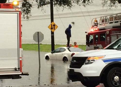 A car is stranded in deep water near Carrollton Avenue on Wednesday morning. (photo submitted by Drew Ward)