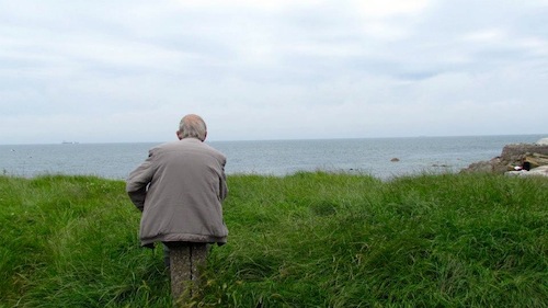 An Irish man looks over the Atlantic Ocean just south of Dublin  (via Jessica DeBold,   Uptown Messenger)
