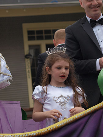 Young rider on the Queen of 2013's float. Krewe of Carrollton 2014. (Zach Brien, UptownMessenger.com)