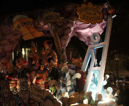 An Evacuspot statue holding a beverage adorns the front of the Krewe d'Etat "Hurricane" float. (Robert Morris, UptownMessenger.com)