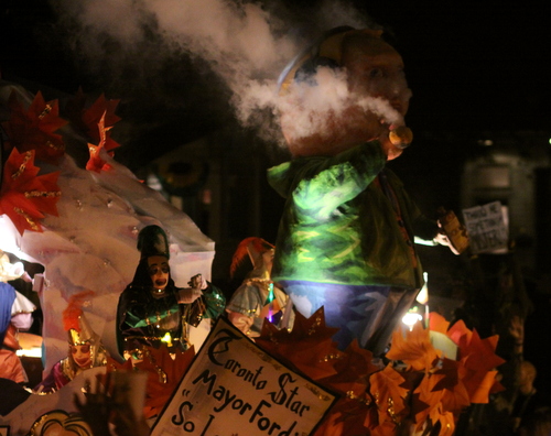 The Krewe d'Etat depiction of Toronto Mayor Rob Ford spews smoke over Napoleon Avenue. (Robert Morris, UptownMessenger.com)
