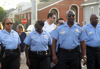 NOPD Lt. Shaun Ferguson (second from right) marches in an anti-crime march through west Carrollton in September 2013. (UptownMessenger.com file photo by Sabree Hill)