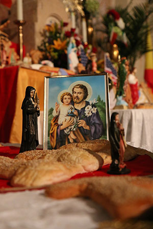 Saint Joseph picture among statues and more decorative bread created by NOCCA students. (Zach Brien, UptownMessenger.com)