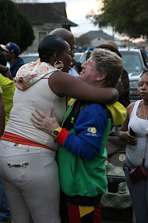Quint Davis, founder of the New Orleans Jazz and Heritage Festival, embraces an onlooker on St. Joseph's Night. (Zach Brien, UptownMessenger.com)
