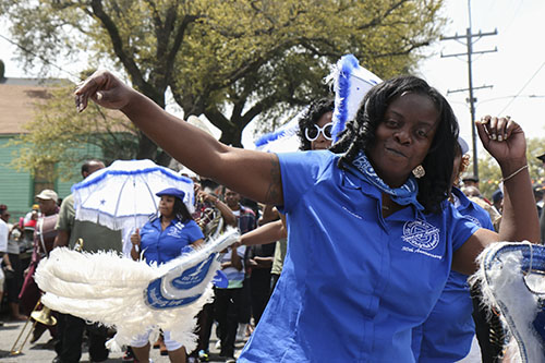 Lady Buck Jumpers paraded with the TBC brass band on Sunday. (Zach Brien, UptownMessenger.com)