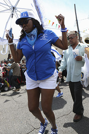 Lady Buck Jumpers paraded with the TBC brass band on Sunday. (Zach Brien, UptownMessenger.com)