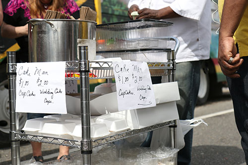 The Cake Man was peddling sweets along La Salle on Sunday afternoon. (Zach Brien, UptownMessenger.com)
