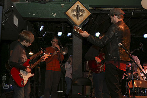 Michael Kyrlakoudes (left) receives guitar pointers from Little Big Horns’ guitarist Russell Welch during the Sunday Jan. 26,2014 Youth Music Workshop at Tipitina's on Napoleon Avenue.
