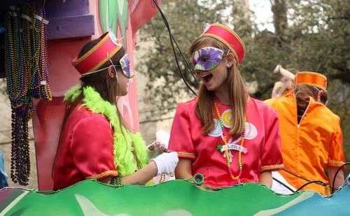 Riders on the Iris "Rock Candy" float laugh together. (Robert Morris, UptownMessenger.com)