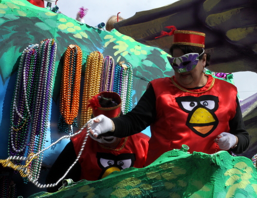 The Angry Birds video game characters make their way onto the Iris "Rockin Robin" float riders' costumes. (Robert Morris, UptownMessenger.com)