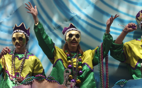 A rider in the Krewe of Okeanos laughs with the Magazine Street crowds. (Robert Morris, UptownMessenger.com)