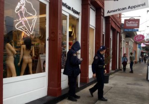 Police outside of American Apparel on Magazine Street after the March 6 armed robbery. (UptownMessenger.com file photo by Della Hasselle).