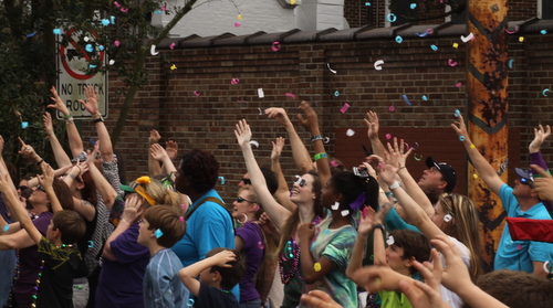Confetti floats over the crowd at Henry Clay Avenue. (Robert Morris, UptownMessenger.com)