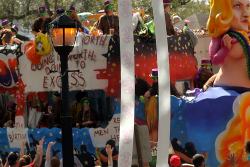 "Anything worth doing is worth doing to excess" reads the Tucks "Bead Whorin'" float. (Robert Morris, UptownMessenger.com)