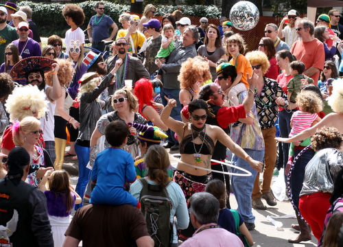 The Disco Amigos dance under a disco ball in the Krewe of Tucks parade. (Robert Morris, UptownMessenger.com)