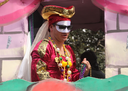 A rider on the Krewe of Tucks maids float. (Robert Morris, UptownMessenger.com)