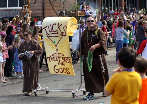 The Krewe of Tucks holds their tradition of throwing toilet paper in high esteem. (Robert Morris, UptownMessenger.com)