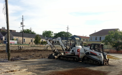 Newly delivered construction equipment sits at the site of the Martin Wine Cellar on Baronne Street on Tuesday evening. (Robert Morris, UptownMessenger.com)