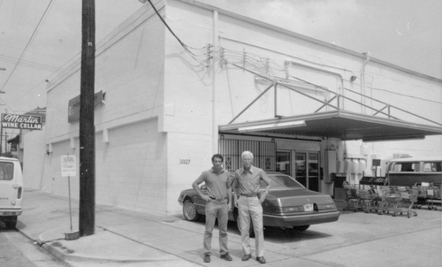 Cedric Martin (left) and David Y. Martin Jr. stand by the former Baronne Street location of Martin Wine Cellar in the mid 1980s. (submitted photo)