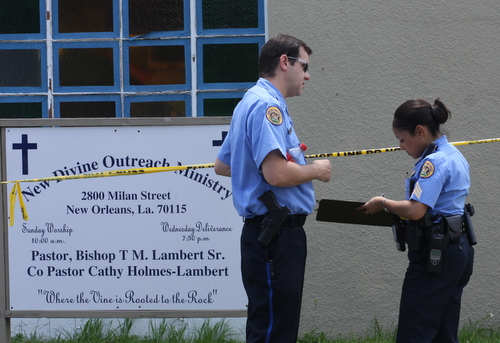 Police investigate a fatal shooting on Milan Street. (Robert Morris, UptownMessenger.com)