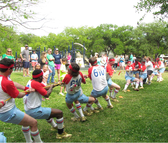 610 Stompers compete in a game of tug-of-war at ROMP! 2013 (via habitat-nola.org)