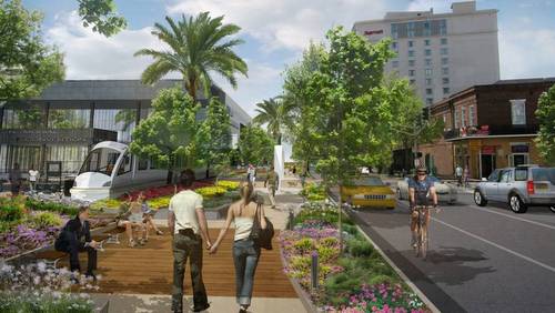 A view of the proposed Convention Center Boulevard linear park and people mover. (via mccno.com)