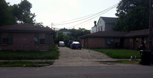 Apartments on Jena Street where a man allegedly forced his mother to play Russian roulette on Sunday, wounding himself in the process, police say. (Robert Morris, UptownMessenger.com)