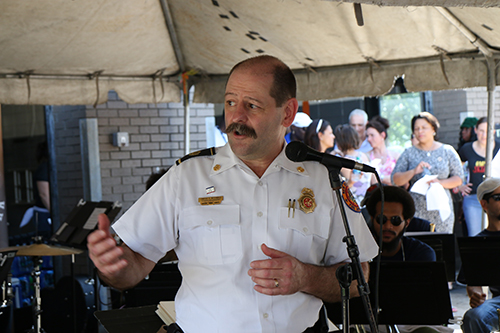 Timothy McConnell, chief at the Central City Fire Station, addressed the crowd before the Orchestra performed. (Zach Brien, UptownMessenger.com)