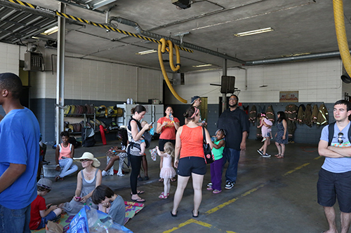 Attendees found relief from the 90 degree heat inside the fire station. (Zach Brien, UptownMessenger.com)