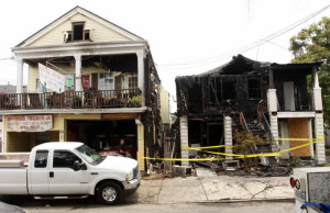 Two buildings burned early Wednesday morning in the 800 block of Cadiz. (Robert Morris, UptownMessenger.com)