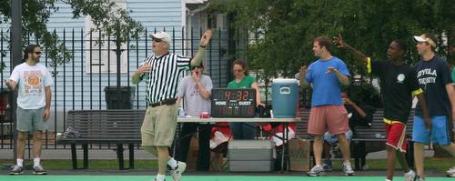 Kara Morgan (center) runs a scoreboard and timer powered by an extension cord from the home next door during makeshift neighborhood basketball tournaments in the Irish Channel. (submitted photo)